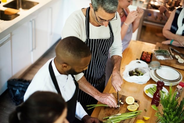 Atelier cuisine team building : un groupe d'amis prépare un repas dans une cuisine